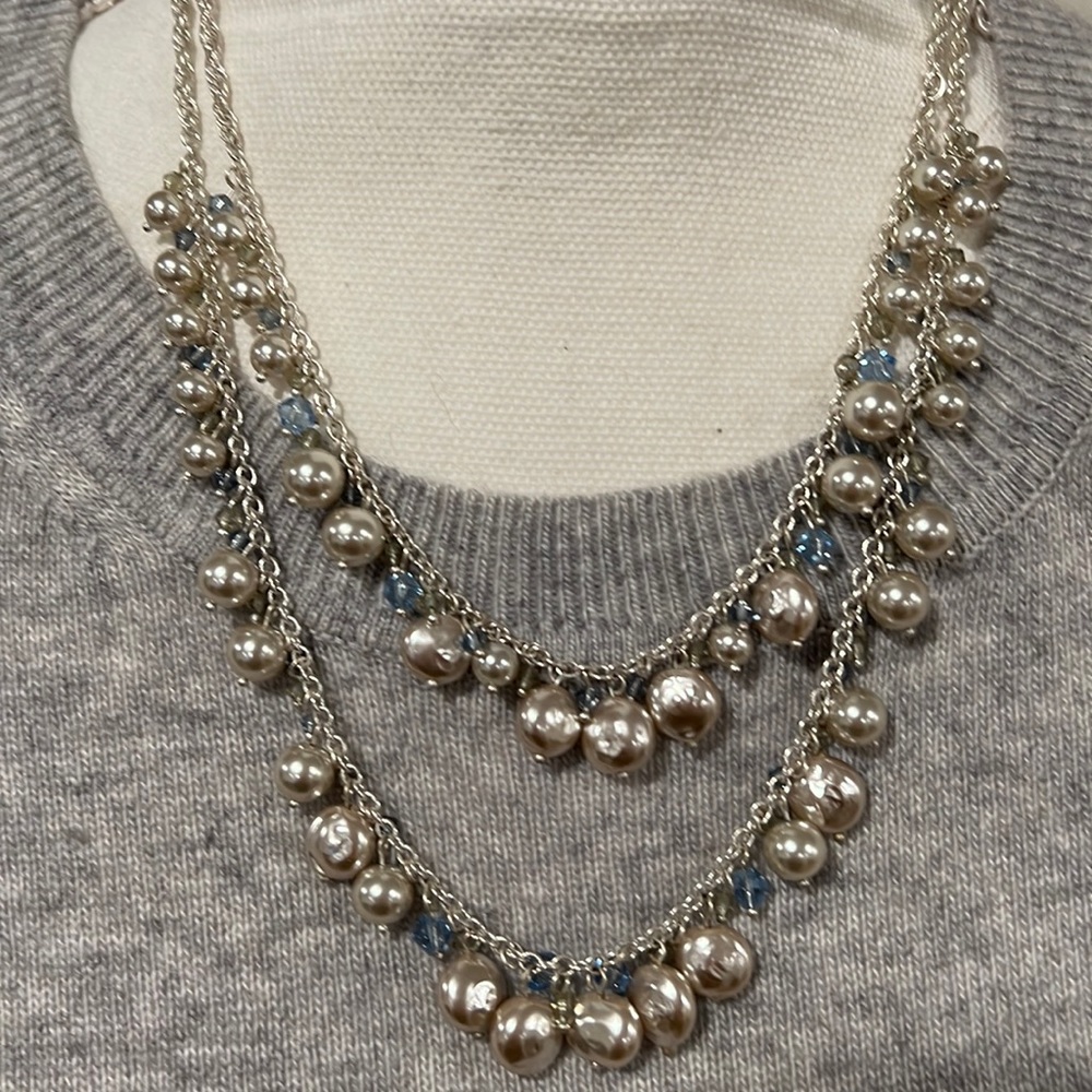 Double strand necklace with silver and light blue beads